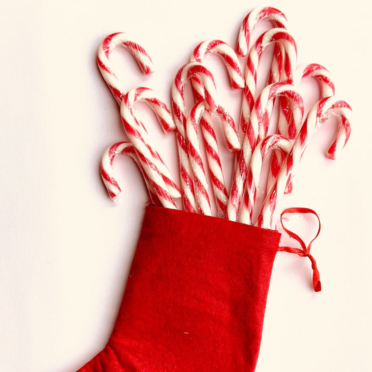 Red Christmas stocking stuffed with candy canes
